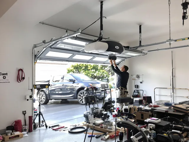 New London Garage Door Repair specialist installing smart garage door opener system in New London home