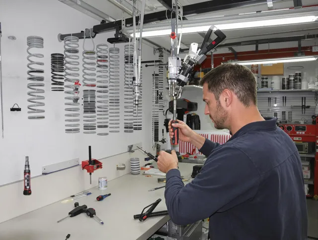 New London Garage Door Repair safety certified technician performing precision spring replacement in New London